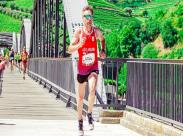 Male Runner Running on a Concrete Bridge_front